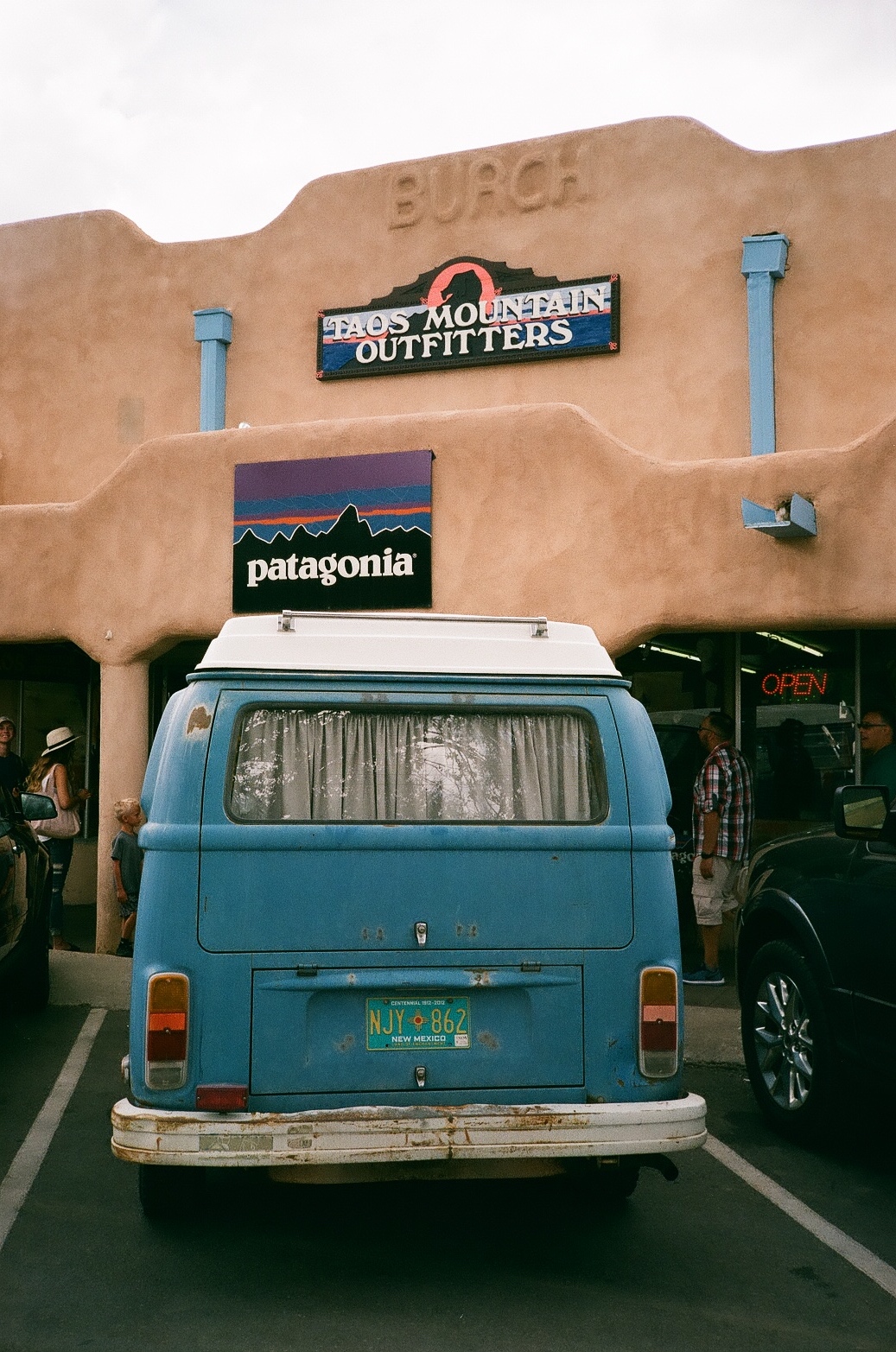 VW Campervan in front of Patagonia sign at Taos Mountain Outfitters in the Plaza | 35mm photograph shot on Nikon L35af | Kodak Gold 200